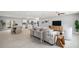 Open-concept living space with kitchen and dining areas, modern furniture, and seamless flow to other rooms at 2905 Forest Cir, Seffner, FL 33584