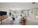 Bright living room with natural light, neutral tones, tile floors, modern furnishings, and view to the front yard at 2905 Forest Cir, Seffner, FL 33584