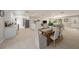 Open-concept living space combining the kitchen, dining, and living area with a cohesive design and tile floors at 2905 Forest Cir, Seffner, FL 33584
