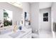 Bathroom featuring gold fixtures, vanity, walk-in shower, and natural light at 3005 1St N Ave, St Petersburg, FL 33713
