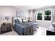 Bright bedroom with a comfortable bed, large windows and stylish bedside tables and decor at 3005 1St N Ave, St Petersburg, FL 33713