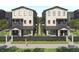 Modern townhome showcasing a neutral palette, welcoming front porches, and manicured landscaping at 3005 1St N Ave, St Petersburg, FL 33713