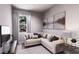 Comfortable living room with plush sofa, modern decor, and a view of the outside greenery at 3005 1St N Ave, St Petersburg, FL 33713