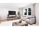 Relaxing living room with neutral colors, large windows, hardwood floors, and comfortable seating at 3005 1St N Ave, St Petersburg, FL 33713