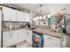 Well-lit kitchen with stainless appliances, granite counters, and unique decorative touches at 3015 Florida Blvd, Bradenton, FL 34207