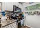 This well-appointed kitchen features stainless steel appliances, granite countertops, and a bright window view at 3015 Florida Blvd, Bradenton, FL 34207