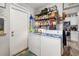 This laundry room features a washer and dryer as well as shelves for storage at 3015 Florida Blvd, Bradenton, FL 34207