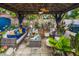 This covered patio features an outdoor living space with comfortable wicker furniture and decor at 3015 Florida Blvd, Bradenton, FL 34207