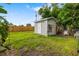 This shed sits in the yard behind a fence and offers extra storage at 3015 Florida Blvd, Bradenton, FL 34207