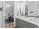 Bathroom features double sinks, modern fixtures, and access to an adjacent exercise area at 303 N Beverly Ave, Tampa, FL 33609