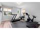 Home exercise room with treadmill, stationary bike, and weight training equipment at 303 N Beverly Ave, Tampa, FL 33609