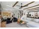 Open-concept living space features a dining area, modern decor, and seamless flow at 303 N Beverly Ave, Tampa, FL 33609