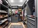 Large walk-in closet with custom shelving and storage solutions for clothing and shoes at 303 N Beverly Ave, Tampa, FL 33609