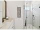 Bathroom featuring a glass-enclosed shower, stylish vanity, and modern fixtures at 3100 W Paul Ave # 15, Tampa, FL 33611
