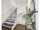 Entryway with modern staircase, hardwood floors, and stylish decor at 3100 W Paul Ave # 15, Tampa, FL 33611