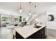 Open-concept living space featuring a gourmet kitchen, cozy living area and staircase at 3100 W Paul Ave # 15, Tampa, FL 33611