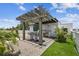 Outdoor kitchen with pergola, bar, and built-in grill on a rooftop terrace at 3100 W Paul Ave # 15, Tampa, FL 33611