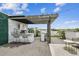 Rooftop terrace with outdoor kitchen, bar area, and string lights at 3100 W Paul Ave # 15, Tampa, FL 33611