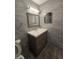Updated bathroom with gray tiled walls, new vanity, and modern lighting at 3123 29Th N Ave # 105, St Petersburg, FL 33713
