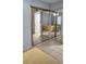 Bedroom featuring mirrored closet doors and neutral color palette at 3123 29Th N Ave # 105, St Petersburg, FL 33713