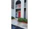 Exterior view of building entrance featuring covered walkway and manicured shrubbery at 3123 29Th N Ave # 105, St Petersburg, FL 33713