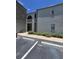 Exterior of building with a two-story elevation and parking at 3123 29Th N Ave # 105, St Petersburg, FL 33713