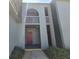 Exterior view of building entrance featuring covered walkway and upper floor balcony at 3123 29Th N Ave # 105, St Petersburg, FL 33713
