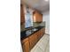 Modern kitchen with double sink, window and beautiful cabinetry at 3123 29Th N Ave # 105, St Petersburg, FL 33713