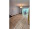 Bright room featuring tile flooring, chandelier, and sliding glass doors at 3123 29Th N Ave # 105, St Petersburg, FL 33713