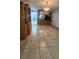 Open-concept room with tile flooring leading to the kitchen at 3123 29Th N Ave # 105, St Petersburg, FL 33713
