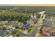 Panoramic aerial view of neighborhood with lush greenery, a scenic lake, and gorgeous homes at 31646 Baymont Loop, Wesley Chapel, FL 33543