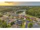Beautiful aerial view of lakeside community featuring well-manicured landscaping and gorgeous homes at 31646 Baymont Loop, Wesley Chapel, FL 33543