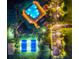 Night aerial view of a community pool, tennis courts, basketball court, playground, parking, and green space at 31646 Baymont Loop, Wesley Chapel, FL 33543