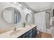 Spacious bathroom featuring double sinks and a bathtub with shower, perfect for relaxing and refreshing at 31646 Baymont Loop, Wesley Chapel, FL 33543