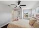 Bright bedroom with a comfortable bed and ceiling fan, offering a peaceful and relaxing retreat at 31646 Baymont Loop, Wesley Chapel, FL 33543