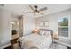 Charming bedroom featuring a comfortable bed, closet, and bathroom, providing a serene retreat at 31646 Baymont Loop, Wesley Chapel, FL 33543