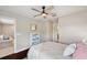 Comfortable bedroom with a ceiling fan, wood floors, and stylish decor for a welcoming ambiance at 31646 Baymont Loop, Wesley Chapel, FL 33543