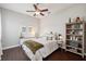 Bedroom features wood floors, ceiling fan, furniture, and a neutral color palette at 31646 Baymont Loop, Wesley Chapel, FL 33543
