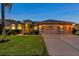 Stunning home featuring a manicured lawn and a spacious three-car garage, perfect for a growing Gathering at 31646 Baymont Loop, Wesley Chapel, FL 33543