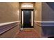 Welcoming front door with brick floor and covered entryway at 31646 Baymont Loop, Wesley Chapel, FL 33543