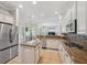 Charming eat-in kitchen with stainless steel appliances, granite countertops, and a central island at 31646 Baymont Loop, Wesley Chapel, FL 33543