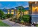Beautiful landscaping, walkway lights, and decorative stone facade provide an appealing exterior at 31646 Baymont Loop, Wesley Chapel, FL 33543