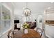 Open concept living area with comfortable seating and natural light from large windows at 31646 Baymont Loop, Wesley Chapel, FL 33543