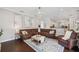 Bright living room with comfortable brown leather seating and neutral decor at 31646 Baymont Loop, Wesley Chapel, FL 33543