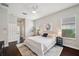 Main bedroom with hardwood floors, natural light and an ensuite bathroom at 31646 Baymont Loop, Wesley Chapel, FL 33543