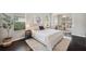 Spacious main bedroom with hardwood floors, natural light, and a seating area near bright windows at 31646 Baymont Loop, Wesley Chapel, FL 33543