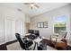 This modern office features a ceiling fan, neutral walls, hardwood floors and a spacious work area at 31646 Baymont Loop, Wesley Chapel, FL 33543