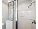 Shower stall with tile surround, clear glass doors, and mounted shower head at 31646 Baymont Loop, Wesley Chapel, FL 33543
