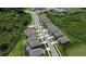 Aerial view of a residential street and surrounding neighborhood with mature trees and lush greenery at 38120 Shale Stone Ct, Zephyrhills, FL 33540