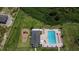 Aerial view of the community pool and playground offering recreational amenities for residents at 38120 Shale Stone Ct, Zephyrhills, FL 33540
